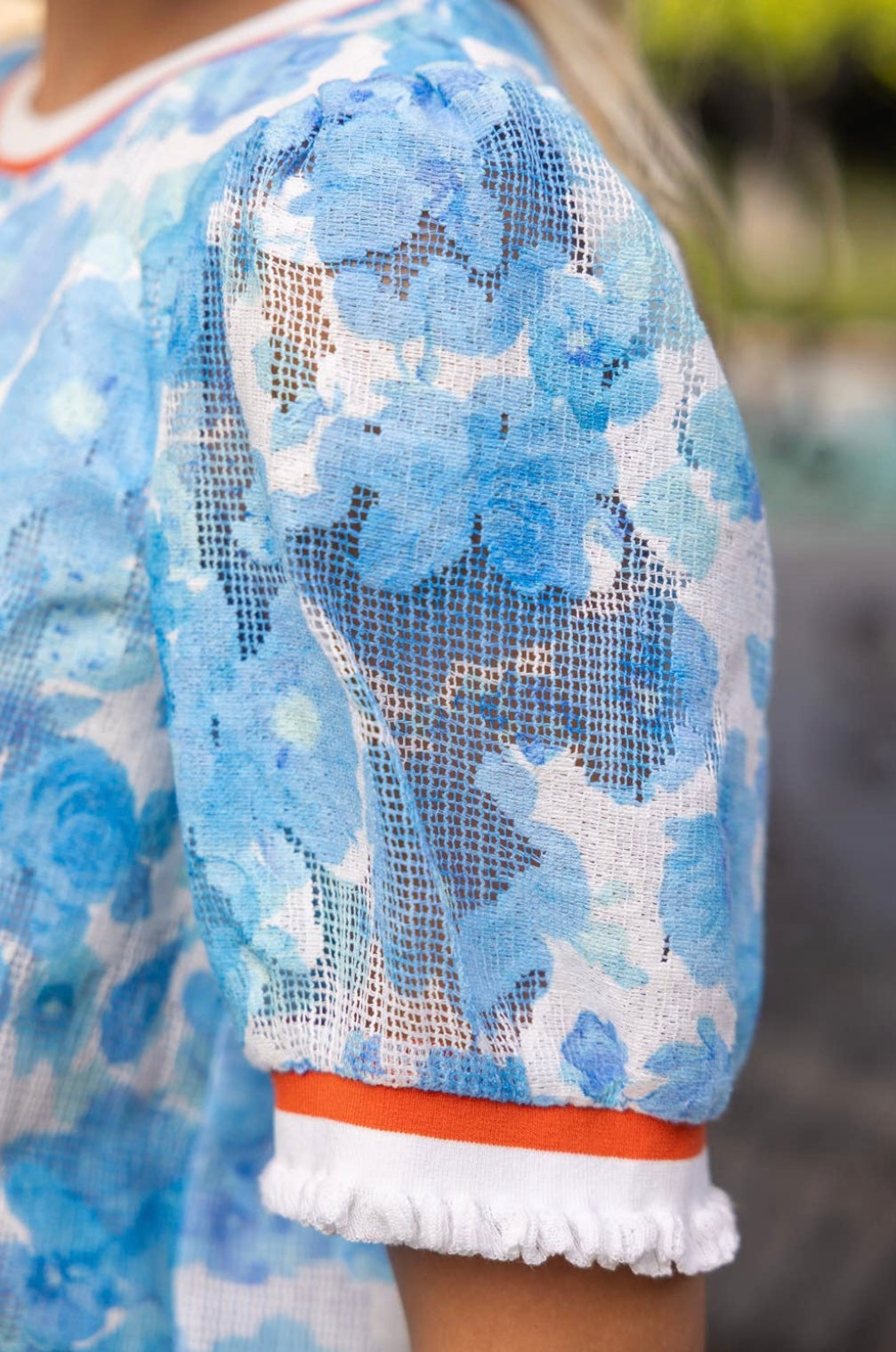 Blue Floral Textured Varsity Top